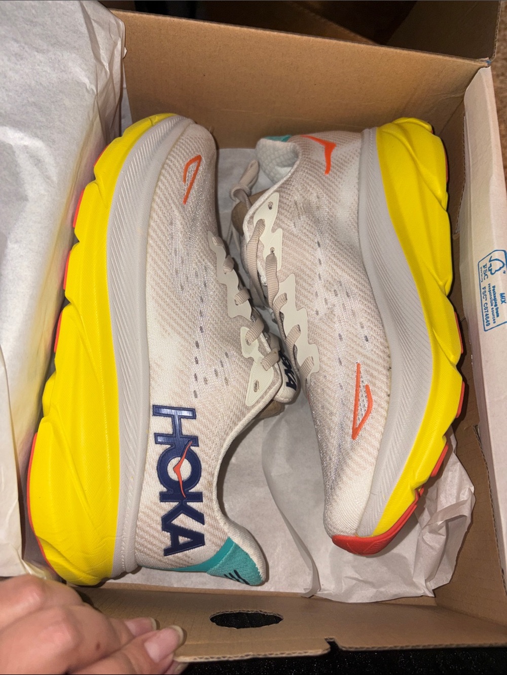 Hoka Women's Athletic Shoes in White with Yellow & Orange Accents